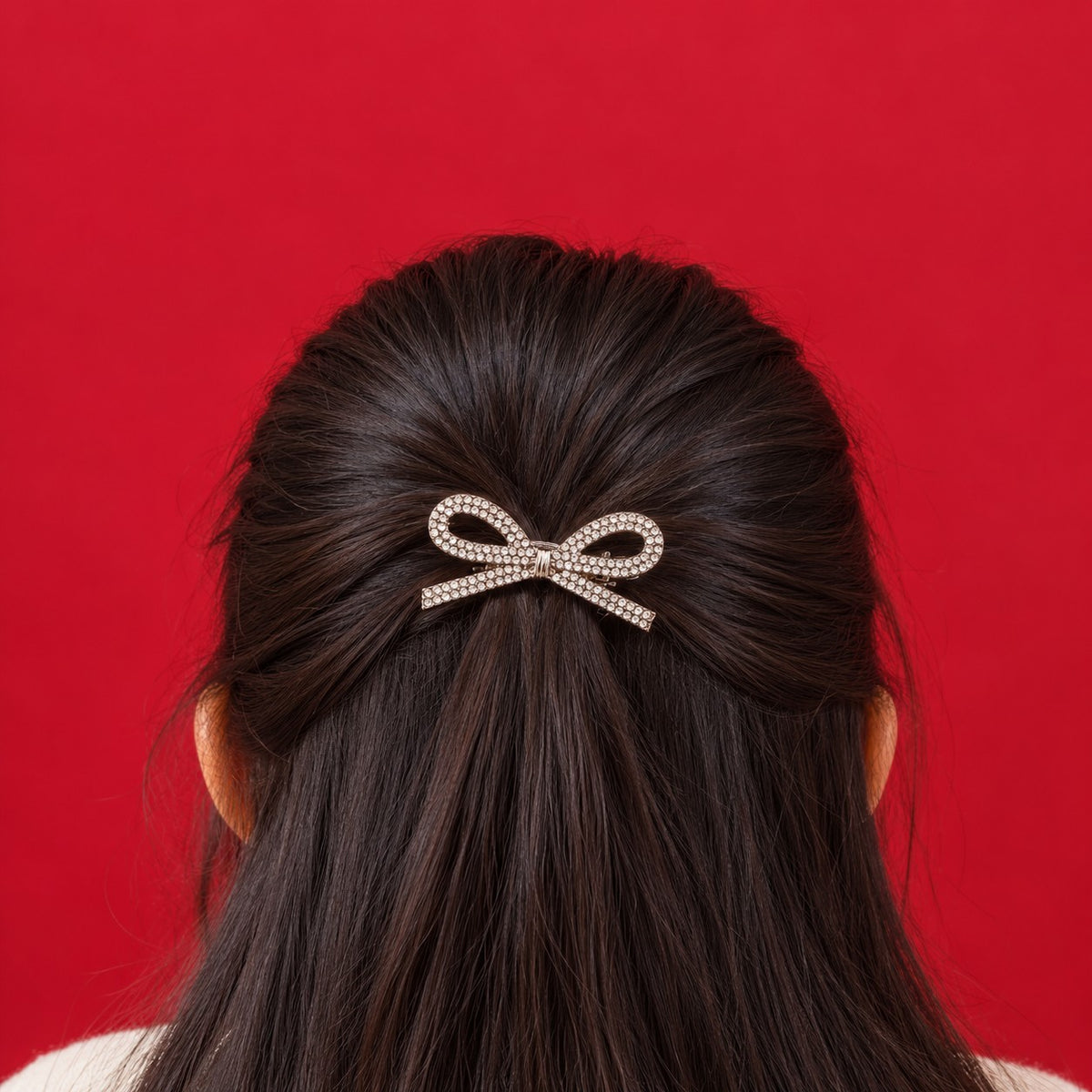 Silver Rhinestone Bow Hairpin worn in a half-up hairstyle