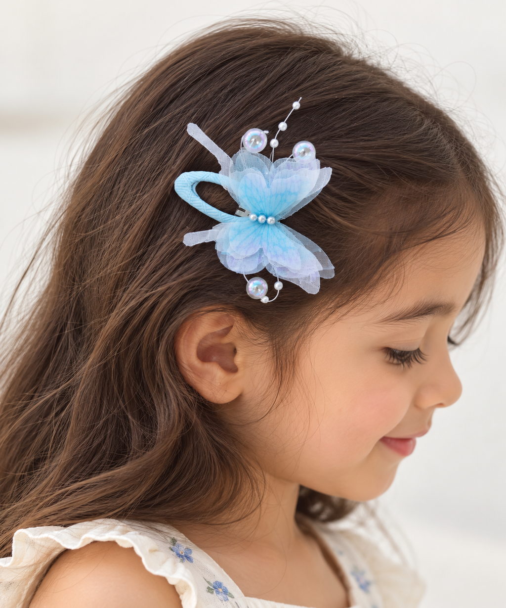 two bobby Candy Floss Butterfly Tic Tacs – Pair – light blue, worn in hair