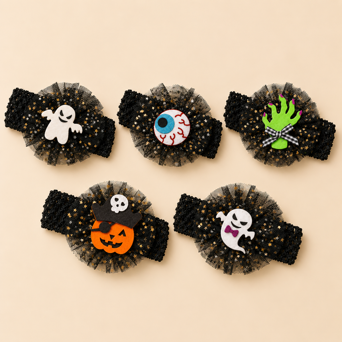 Five Halloween baby headbands in spooky designs