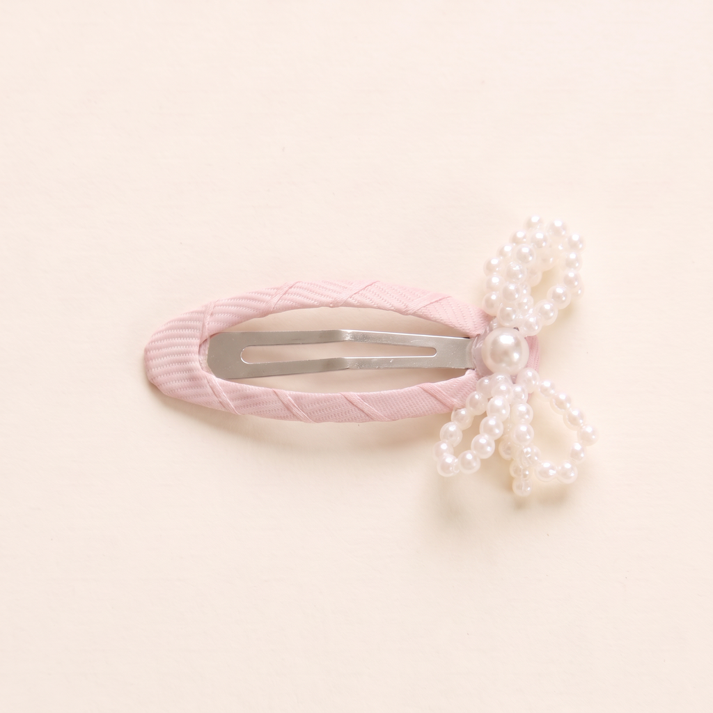 two bobby Mini Pearl Bow Snap Clips, snap clip and pearl bow close-up