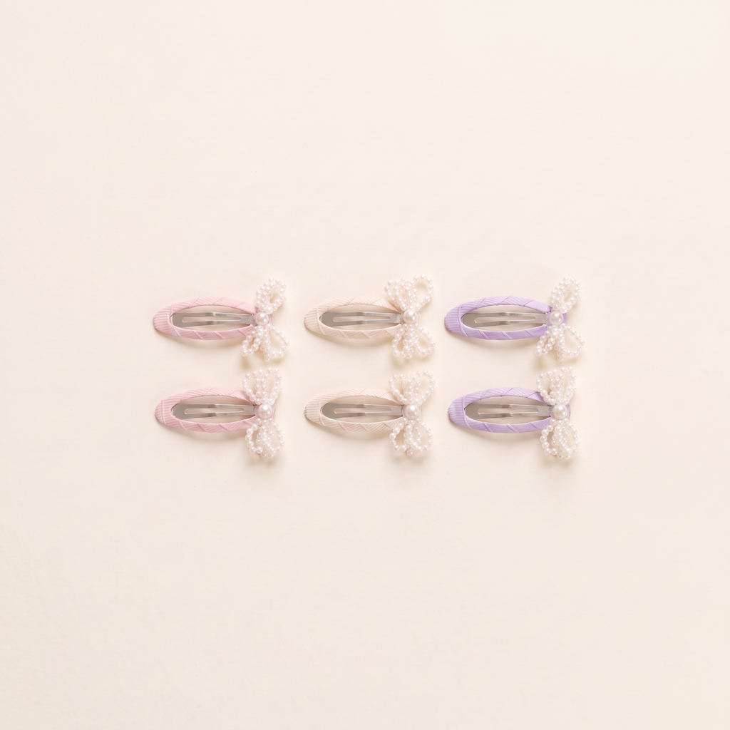 two bobby Mini Pearl Bow Snap Clips - all three colours