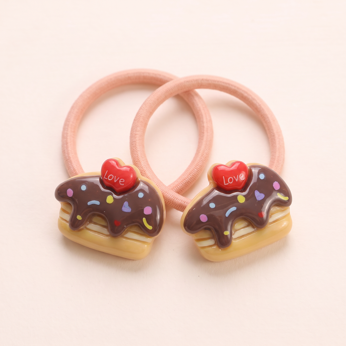 two bobby Sprinkle Cake Hair Ties – Close-up of one pair