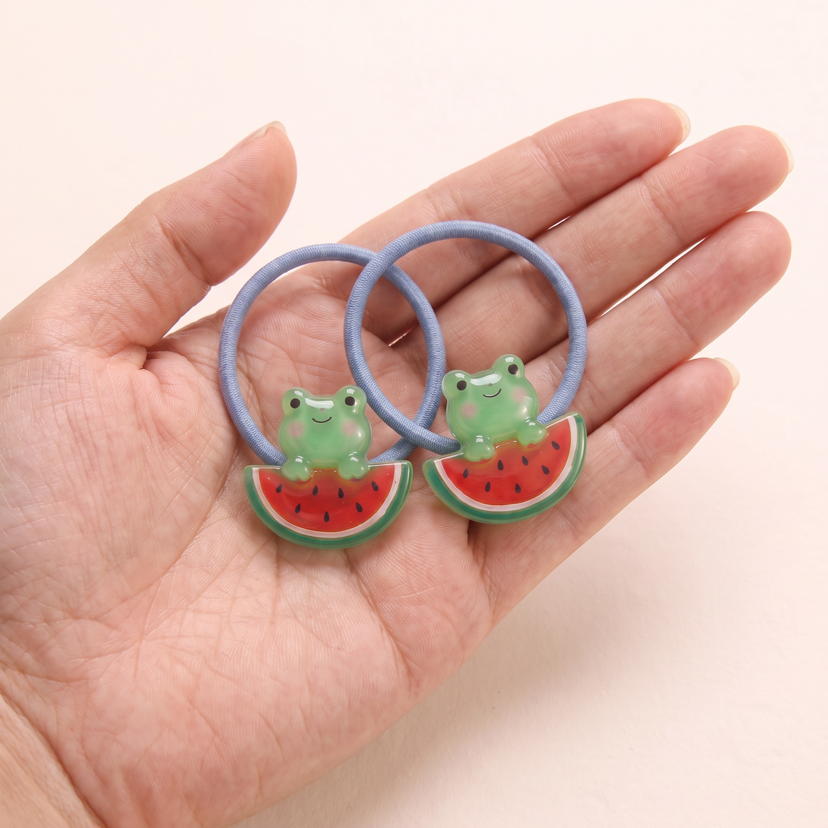 two bobby Jelly Animal Friends Hair Ties – One pair in hand, for size