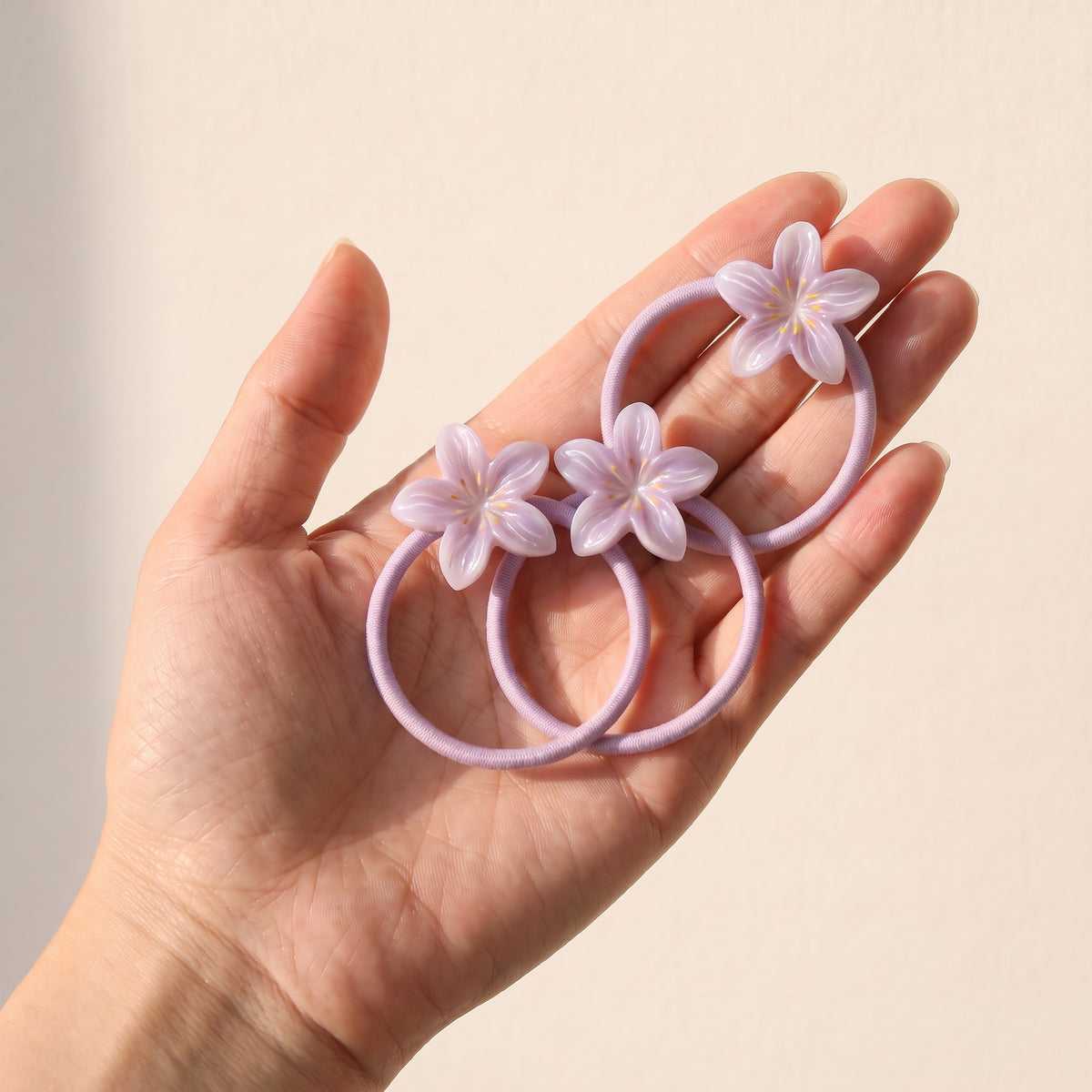 two bobby Jelly Lily Hair Ties – 3 ties in hand, for size