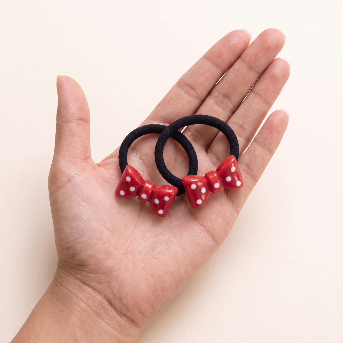 two bobby Polka Bow Hair Ties – One pair in hand, for size
