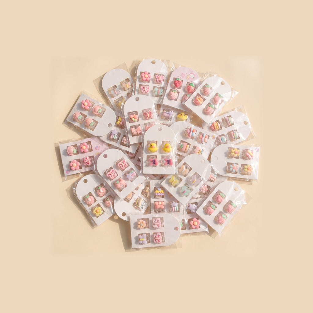 Cards of charm mini claw clips showing the variety of designs