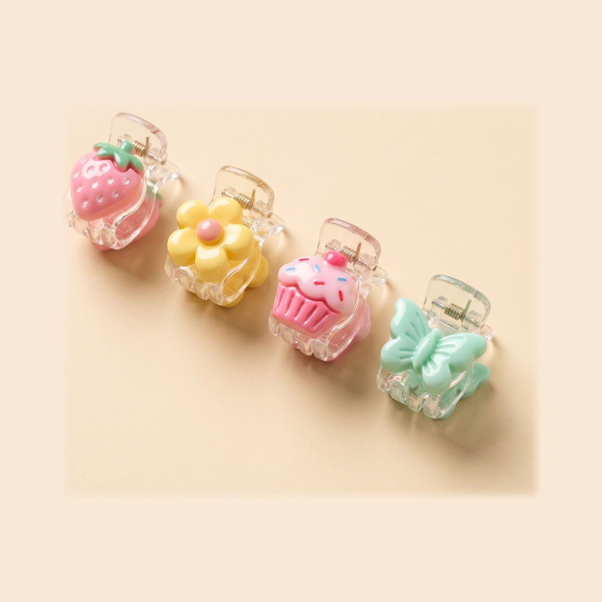 two bobby Charm Mini Claw Clips - four of the assorted charm clips, close up