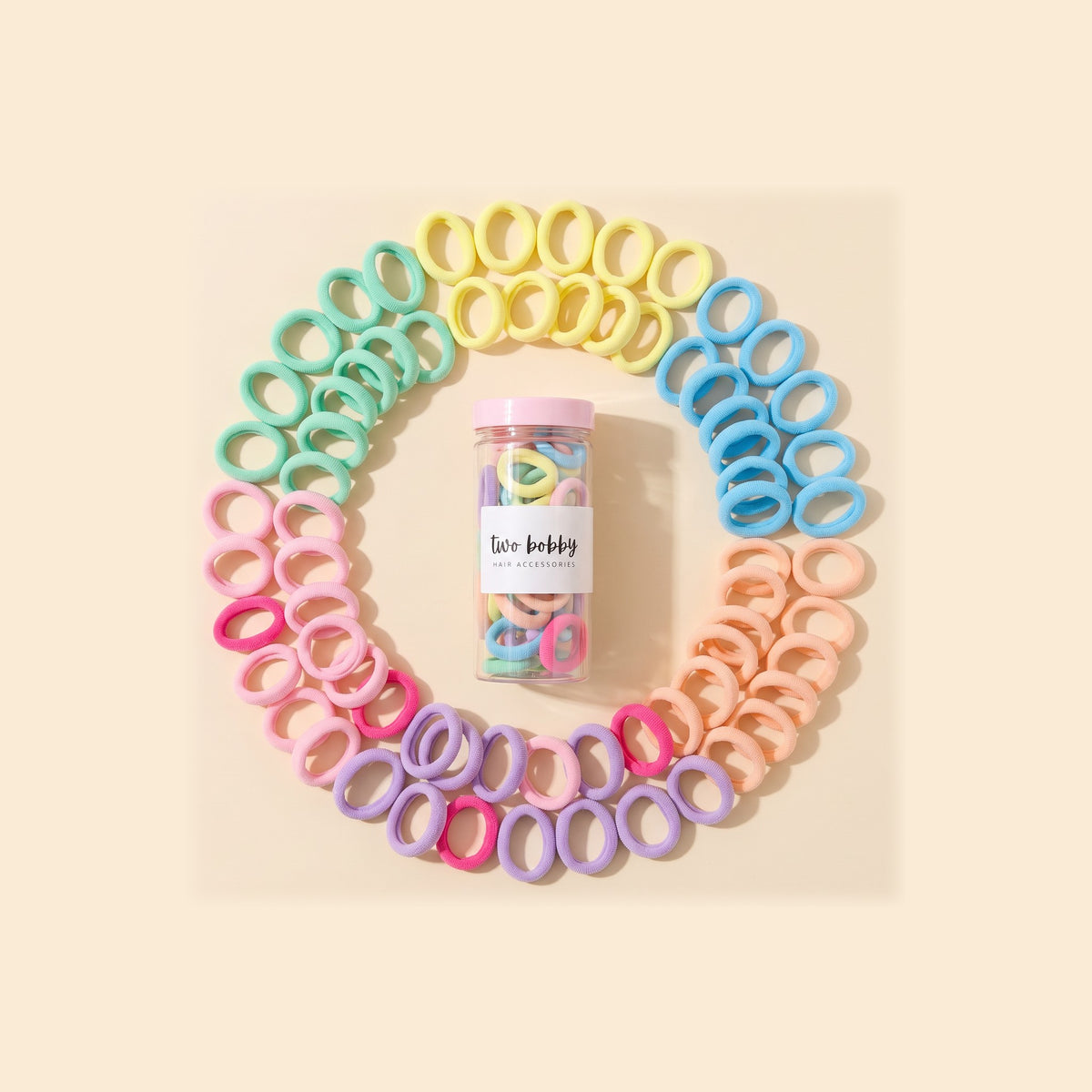 two bobby Everyday Rubber Band Hair Ties - Candy, ring of hair ties round the tube of 100
