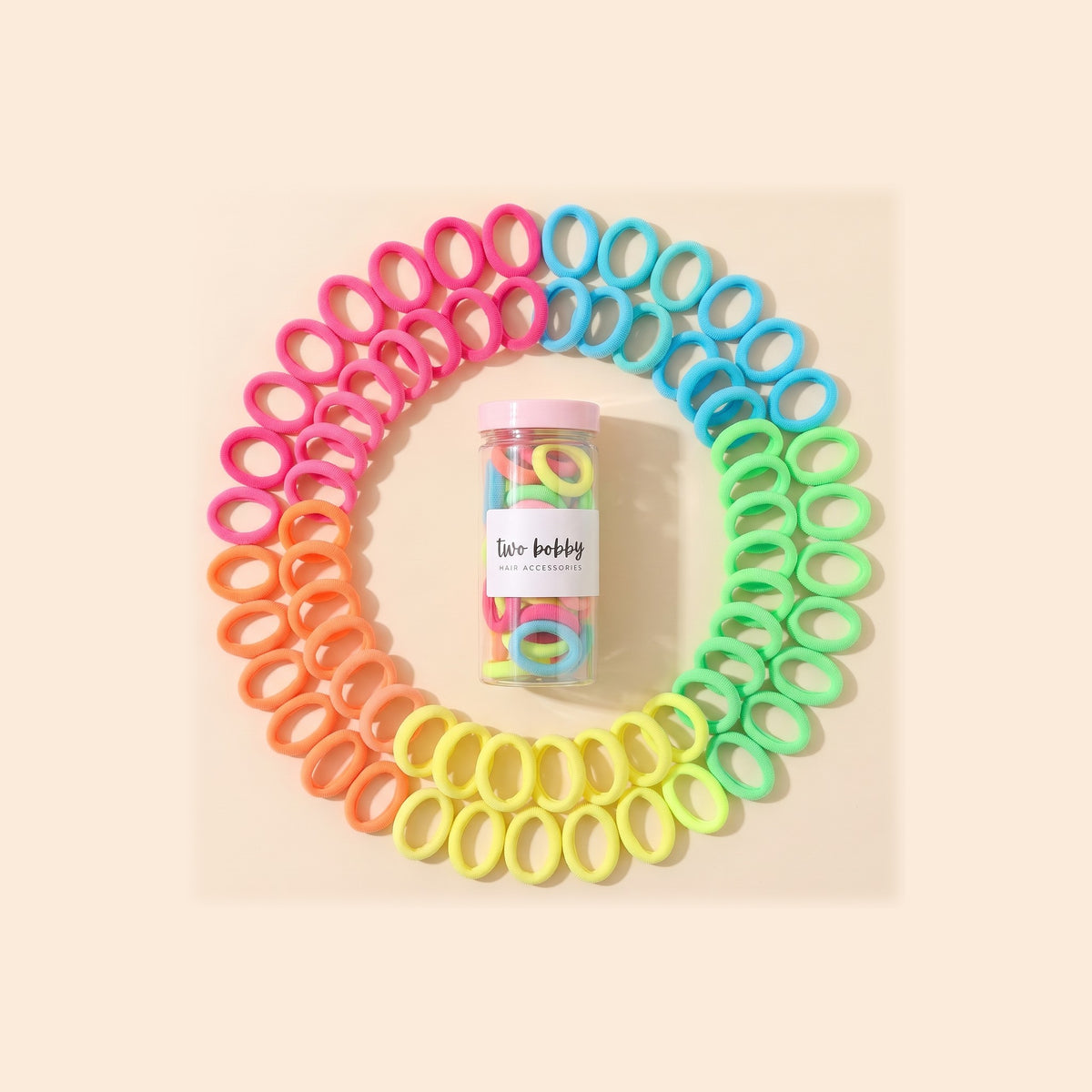 two bobby Everyday Rubber Band Hair Ties - Neon, ring of hair ties round the tube of 100