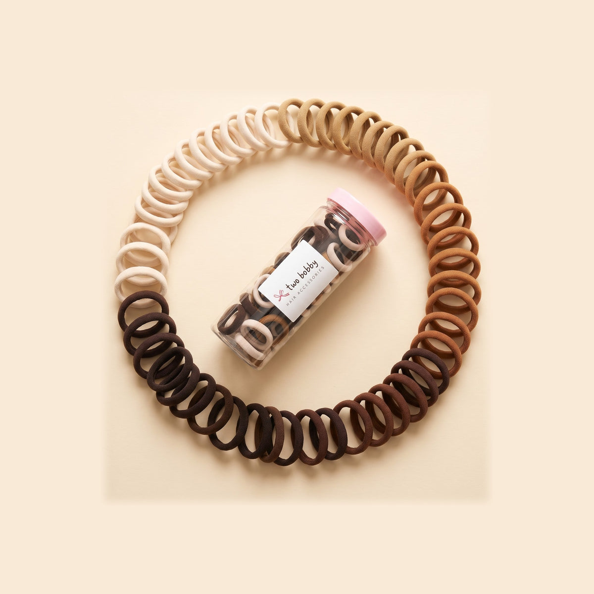 two bobby Everyday Rubber Band Hair Ties - Neutrals, ring of hair ties round the tube of 100