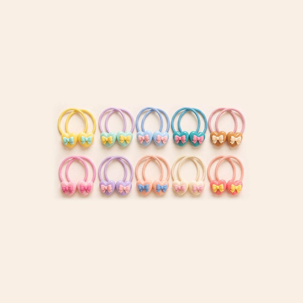 All 10 heart bow hair tie designs in pastel colours - 2 different pairs picked at random