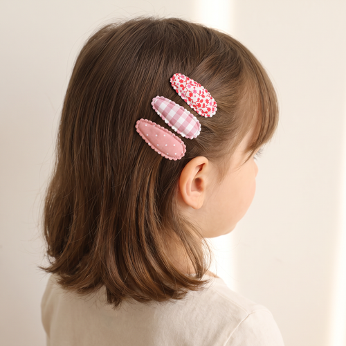 two bobby Mini Fabric Tic Tacs – worn, holding the fringe back