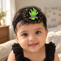 Baby wearing a Halloween Green Monster Hand headband