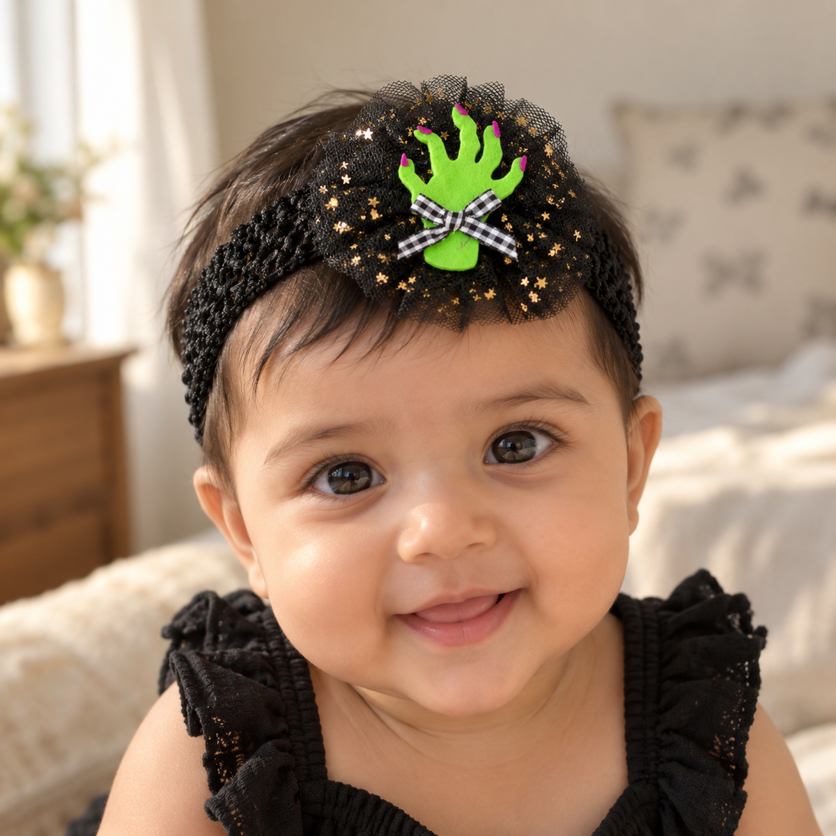 Baby wearing a Halloween Green Monster Hand headband
