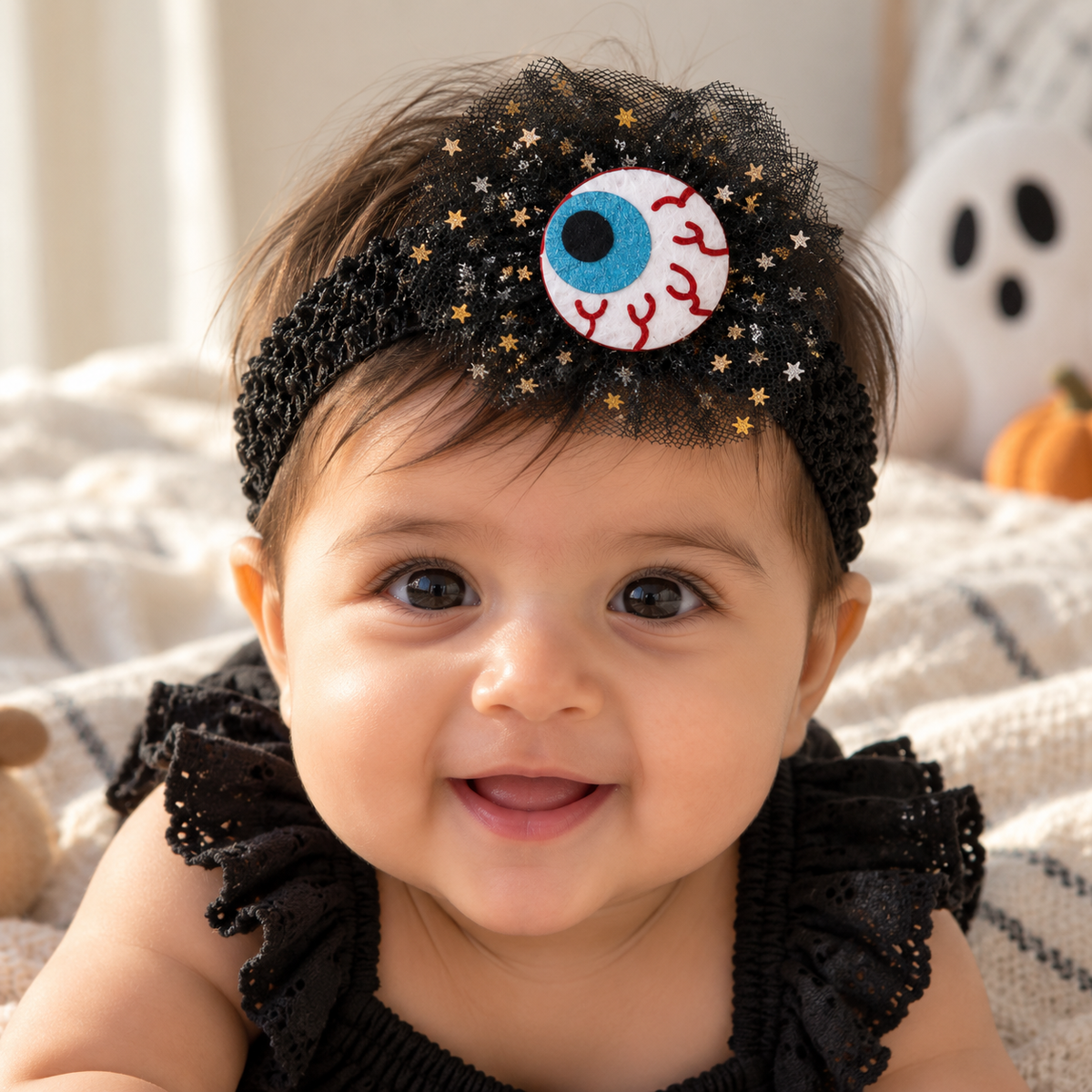 Baby wearing a Halloween Spooky Eyeball headband